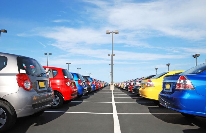 Many cars parked in rows